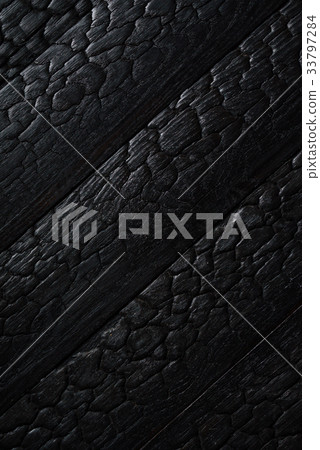 Black burnt wooden texture 33797284