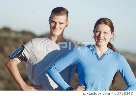 Young couple on beach training together 33798347