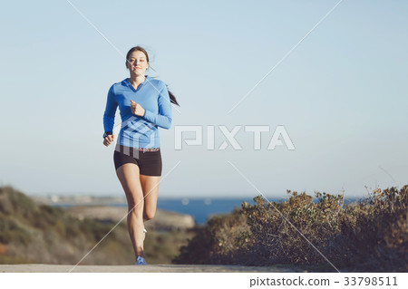 Sport runner jogging on beach working out Sport runner jogging on beach working out 33798511