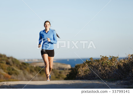 Sport runner jogging on beach working out Sport runner jogging on beach working out 33799141