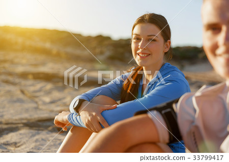 Couple in sport wear on beach Couple in sport wear on beach 33799417