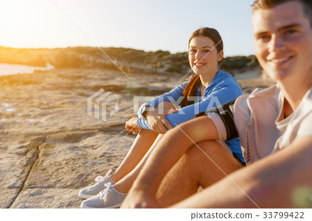 Couple in sport wear on beach 33799422