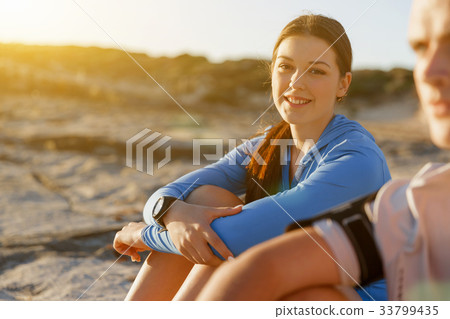 Couple in sport wear on beach Couple in sport wear on beach 33799435