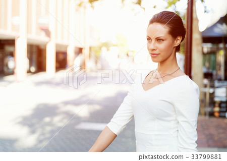 Portrait of business woman smiling outdoor 33799881