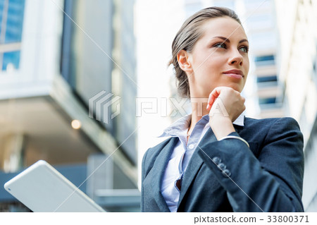 Portrait of business woman smiling outdoor 33800371