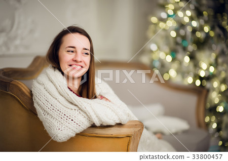 Beautiful young girl in a soft plaid waiting for 33800457