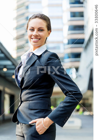 Portrait of business woman smiling outdoor 33800646