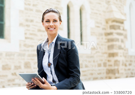 Portrait of business woman smiling outdoor Portrait of business woman smiling outdoor 33800720