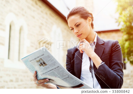 Portrait of business woman smiling outdoor 33800842