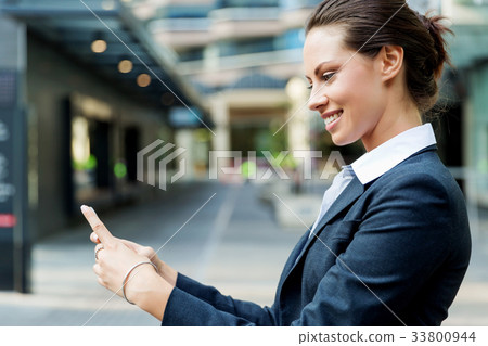 Portrait of business woman smiling outdoor 33800944