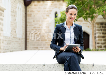 Portrait of business woman smiling outdoor Portrait of business woman smiling outdoor 33801152
