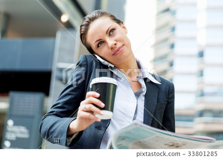Portrait of business woman smiling outdoor 33801285