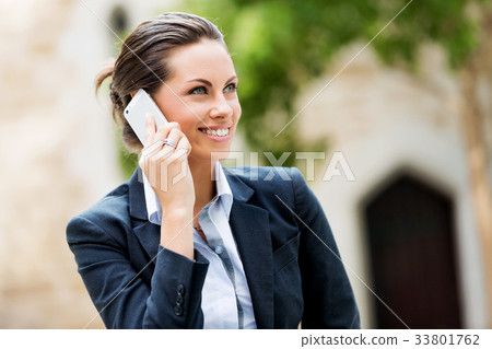 Portrait of business woman smiling outdoor 33801762