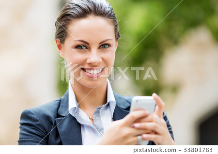 Portrait of business woman smiling outdoor 33801783