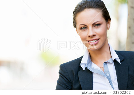 Portrait of business woman smiling outdoor 33802262