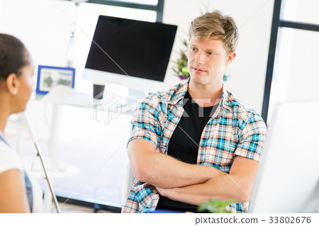 Young man working in office Young man working in office 33802676
