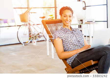 Portrait of smiling afro-american office worker in offfice Portrait of smiling afro-american office worker in offfice 33803242