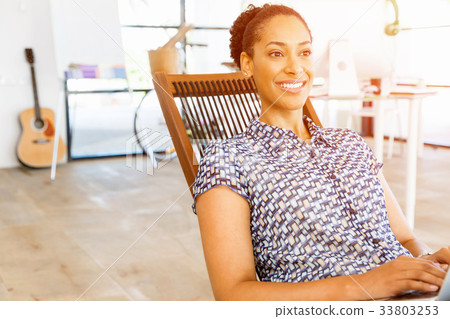 Portrait of smiling afro-american office worker in offfice Portrait of smiling afro-american office worker in offfice 33803253