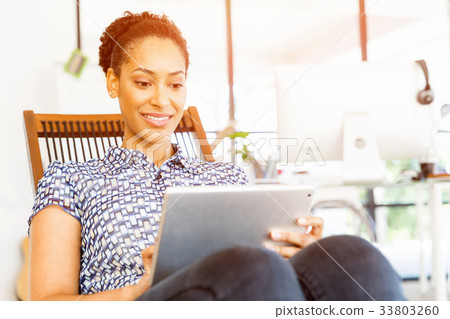 Portrait of smiling afro-american office worker in offfice Portrait of smiling afro-american office worker in offfice 33803260