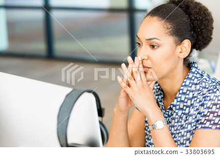 Portrait of tired afro-american office worker sitting in offfice Portrait of tired afro-american office worker sitting in offfice 33803695