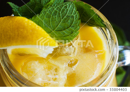 Fruit cocktail partially seen on black background Fruit cocktail partially seen on black background 33804403