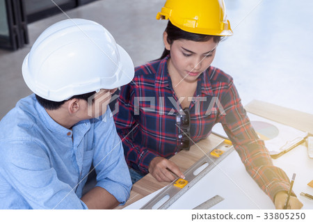 professional male and female engineers working professional male and female engineers working 33805250