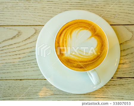 Latte in white cup as breakfast Latte in white cup as breakfast 33807053