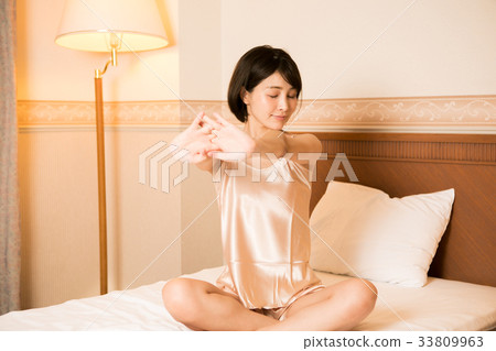 Women stretching in bed 33809963