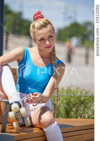 beautiful young blonde girl in a vintage roller skates,  33812866