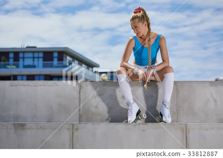 beautiful young blonde girl in a vintage roller skates, 33812887