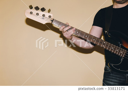 Bass guitar riff closeup. Musical background 33813171