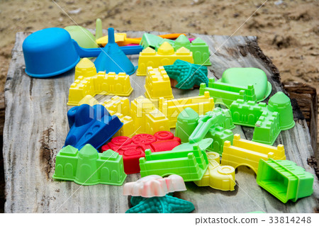 Baby beach sand toys on wood Baby beach sand toys on wood 33814248