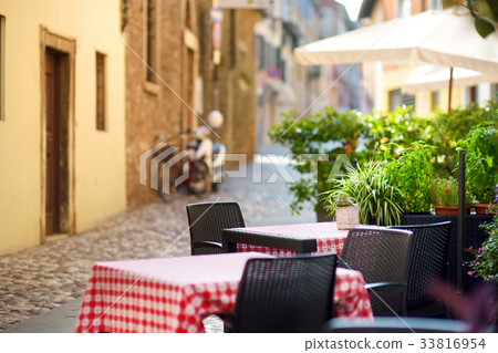 Cosy outdoor cafe in Desenzano del Garda town 33816954