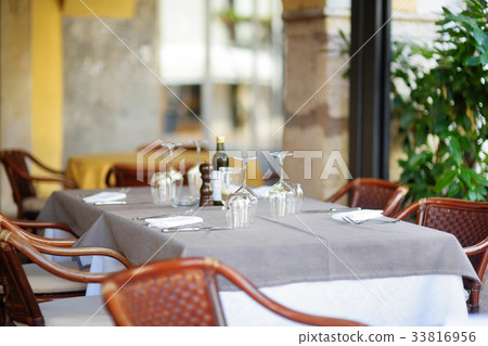 Cosy outdoor cafe in Desenzano del Garda town 33816956