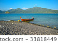 Fishermen and long tail boats anchor, Thailand 33818449