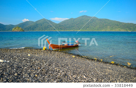 Fishermen and long tail boats anchor, Thailand Fishermen and long tail boats anchor, Thailand 33818449