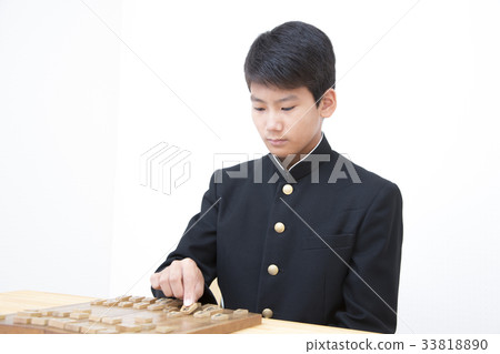 Boy pointing at shogi Boy pointing at shogi 33818890