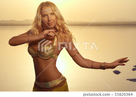 Beautiful blonde belly dancer 33820364