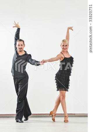Couple dancing isolated over white background Couple dancing isolated over white background 33820751