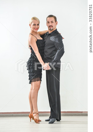 Couple dancing isolated over white background 33820781