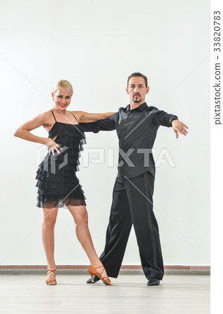Couple dancing isolated over white background 33820783