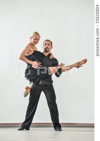 Couple dancing isolated over white background 33820804