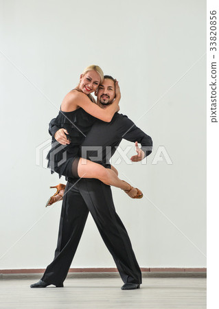 Couple dancing isolated over white background 33820856