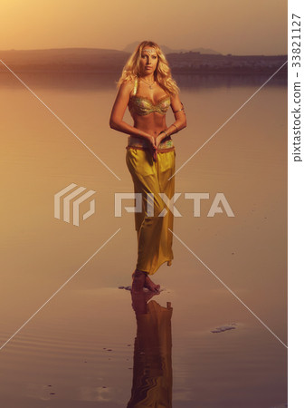 Beautiful blonde belly dancer woman Beautiful blonde belly dancer woman 33821127