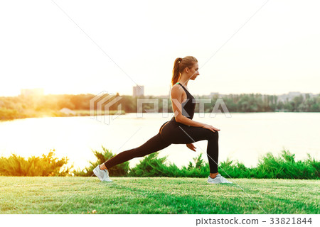 Yoga women silhouette, working on poses at sunset 33821844