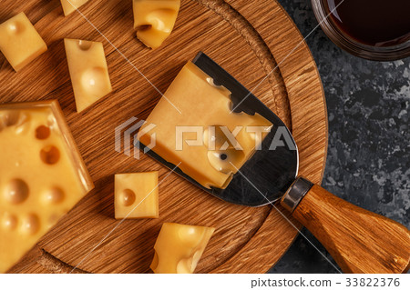 Cheese on cutting board. Cheese on cutting board. 33822376