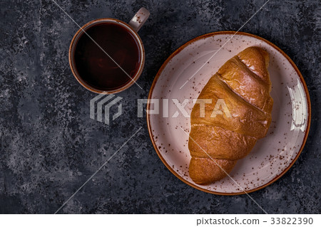 Fresh croissant on dark background. Fresh croissant on dark background. 33822390