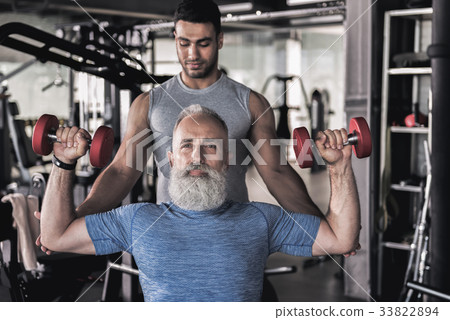 Senior sportsman doing exercises in athletic 33822894