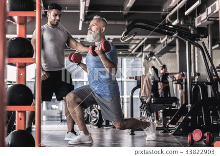 Serious bearded male spending time in sport club Serious bearded male spending time in sport club 33822903