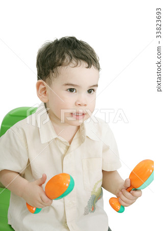 boy with maracas, isolated on white boy with maracas, isolated on white 33823693